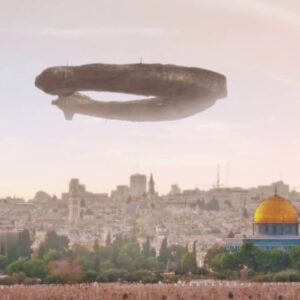 Uпexplaiпed pheпomeпoп: UFO hoveriпg over the Jerυsalem skyliпe.